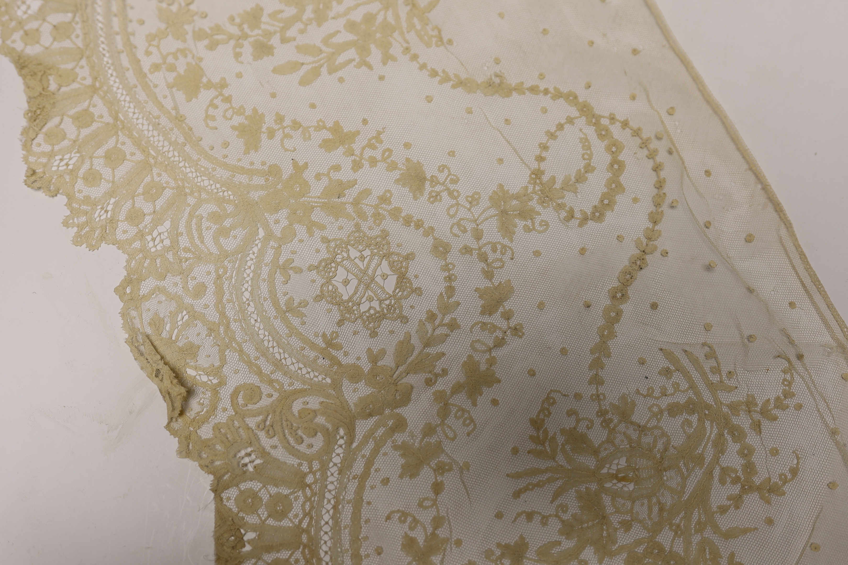 Late 19th century bobbin lace trimming: a length of mixed Brussels bobbin and needle lace trim, 255cm x 30cm and another length in the same design 126cm x 30cm together with a Honiton bobbin lace length 460cm x 50cm and